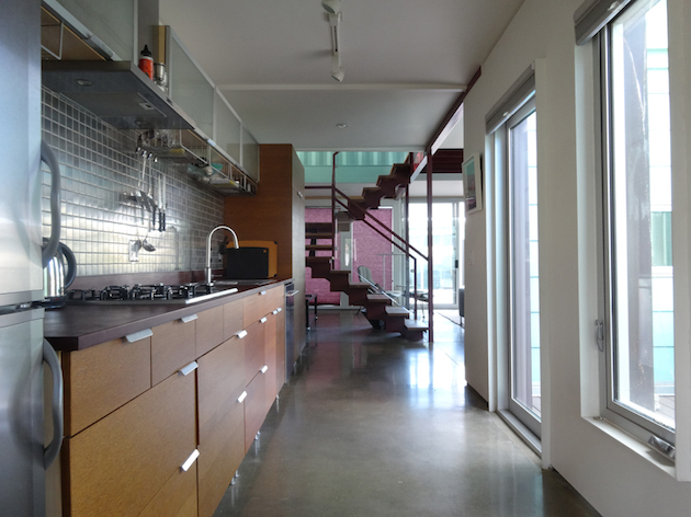 There are concrete floors and walnut wood accents.